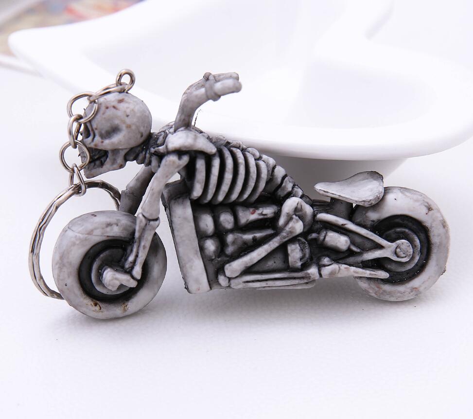 Skeleton man riding a motorcycle keychain