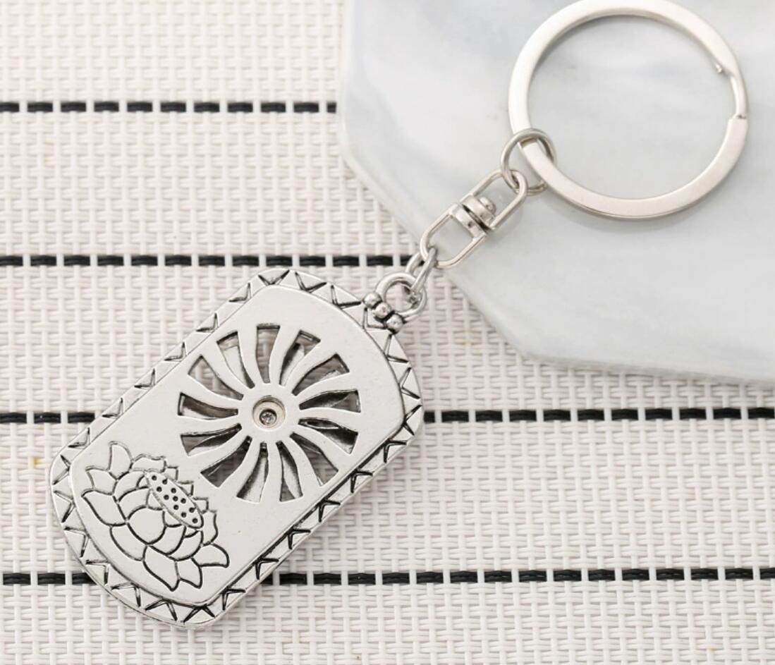 Rotatable sun lotus keychain