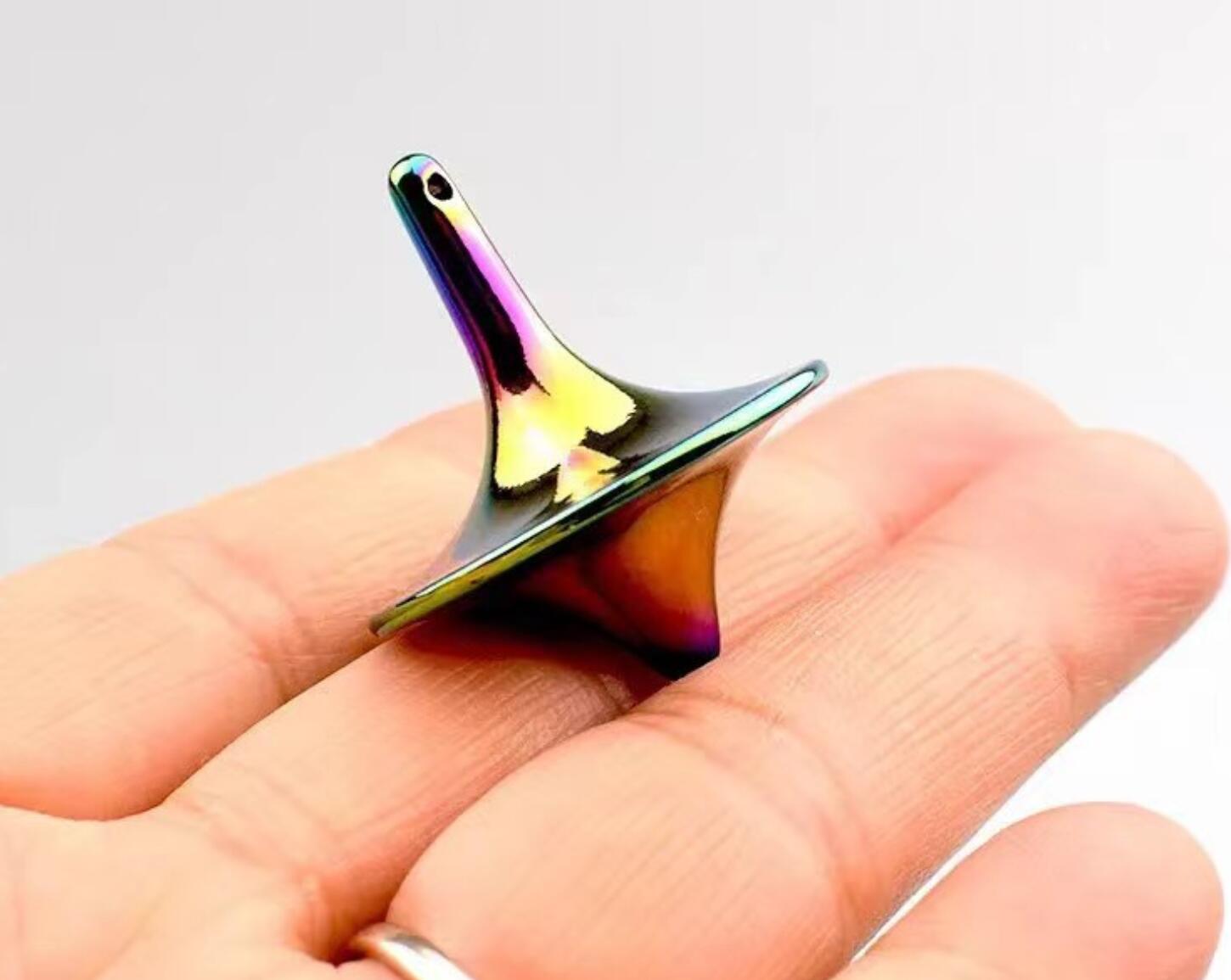 Mini alloy stress toy fingertip spinning top