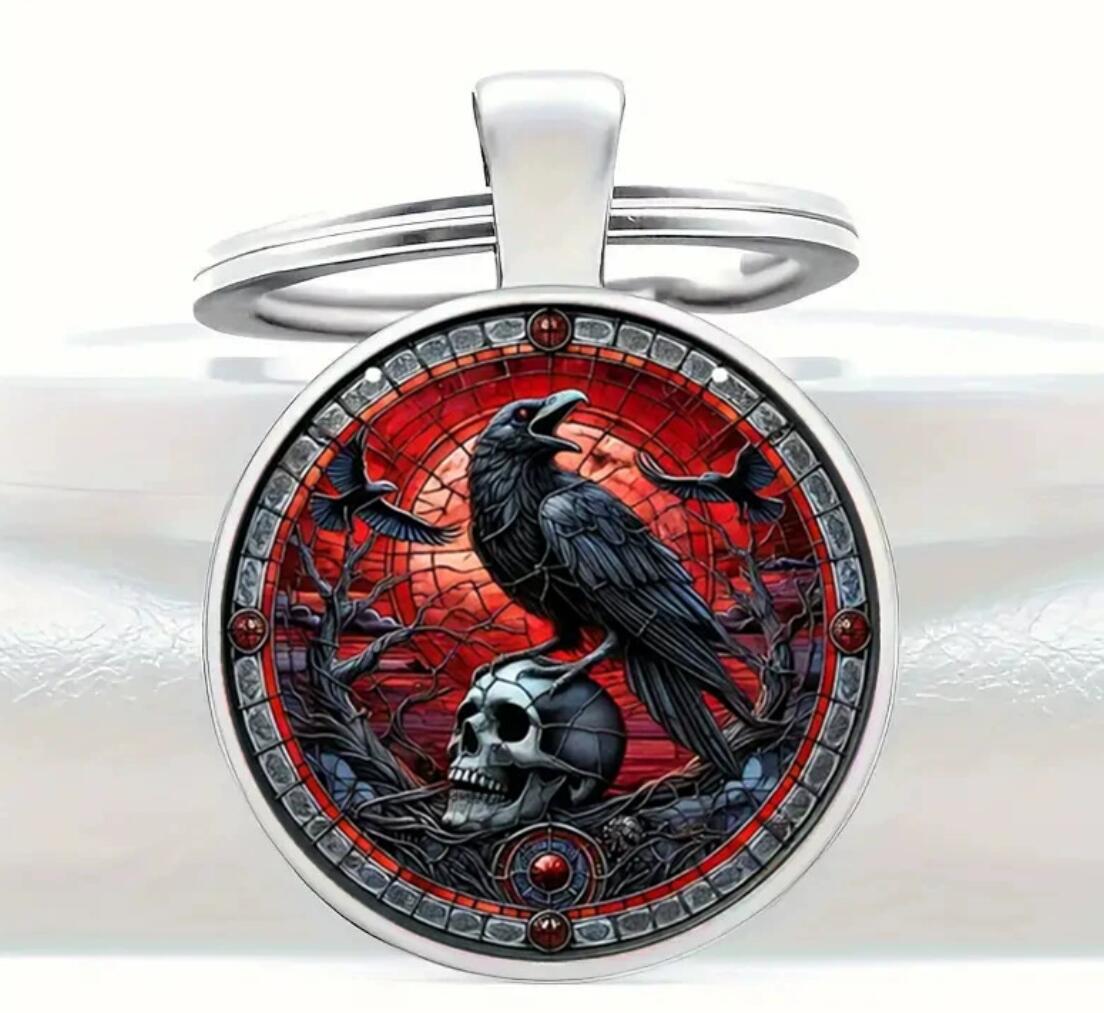 standing on the skull black crow keychain