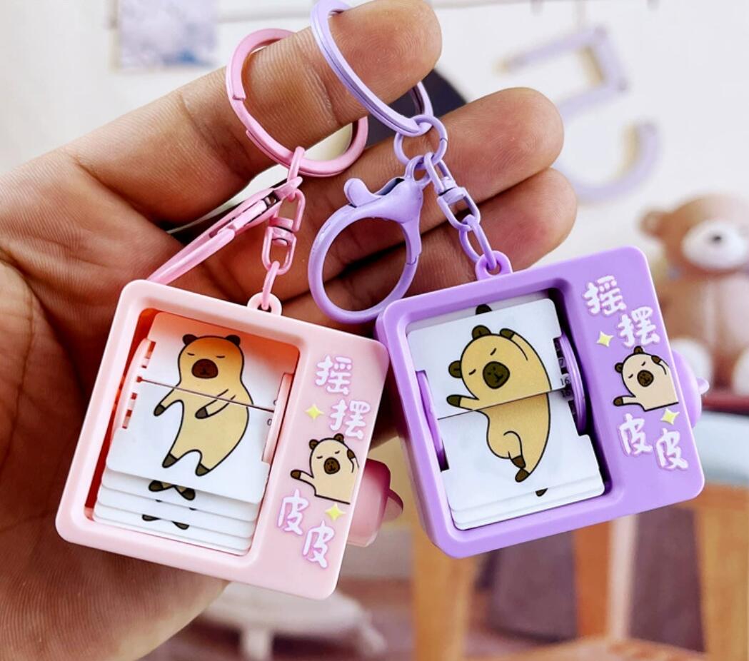 Fun book flipping animation machine keychain
